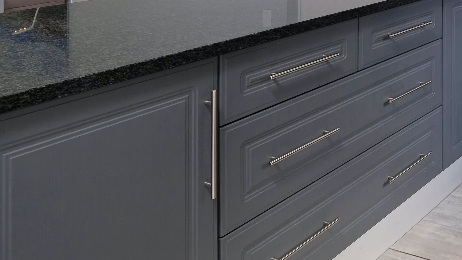 Built to Last Grey painted cabinet doors and drawers with raised-panel profiles